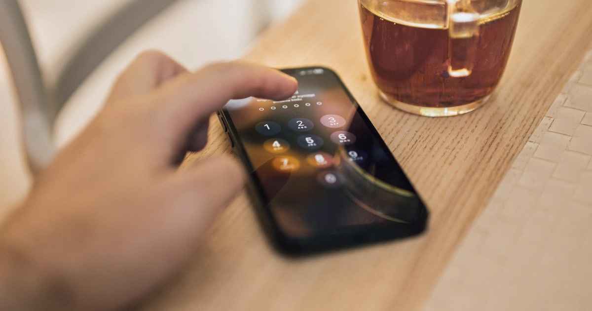 An iPhone on a desk illustrating phone access and privacy protection.
